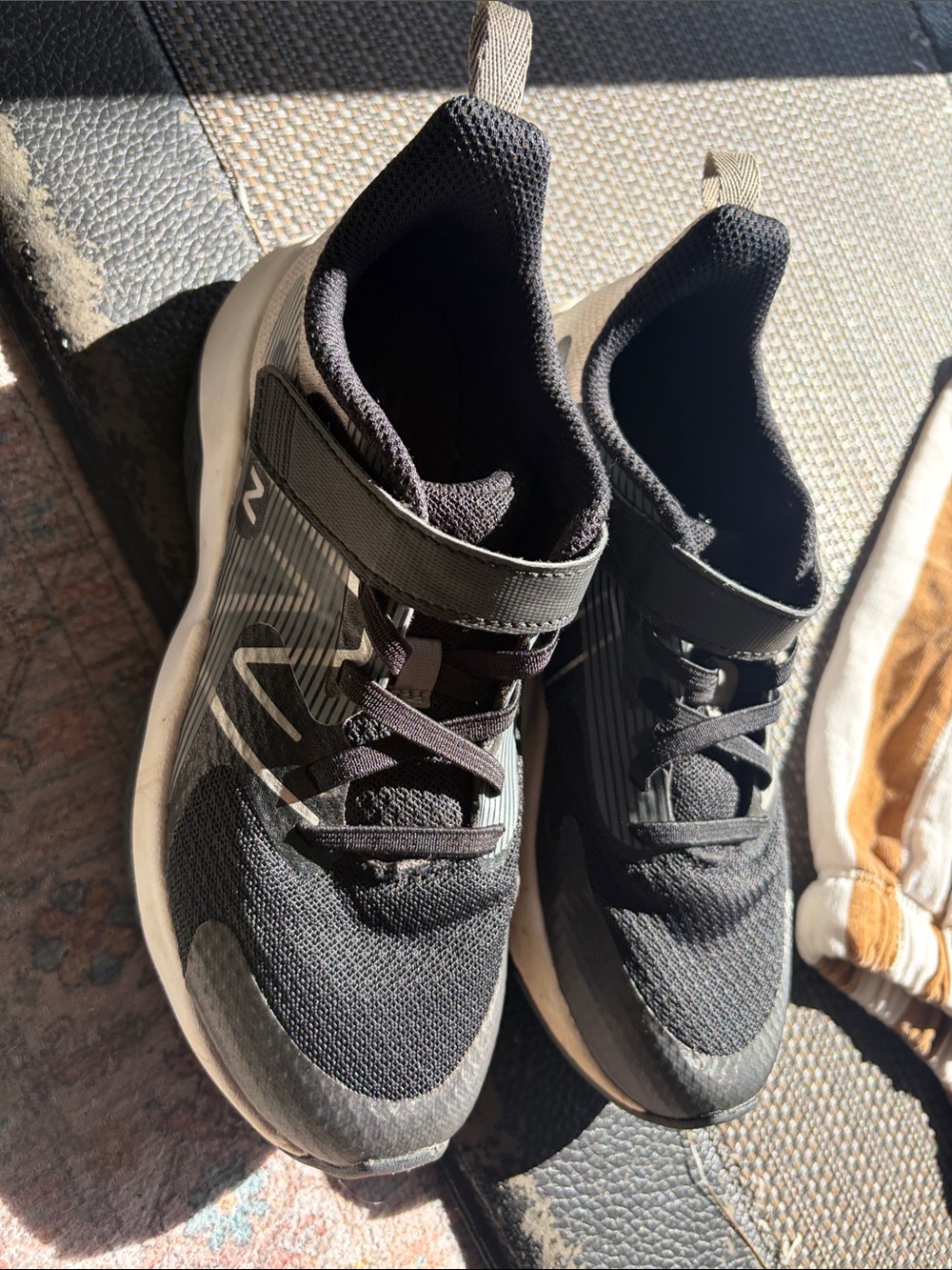 New Balance Kids Black and Tan Sneakers